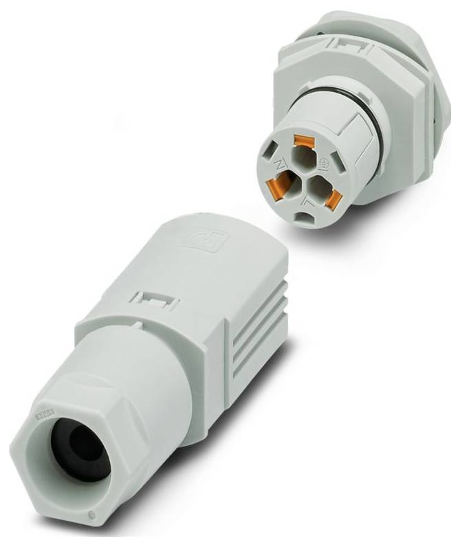Ein grüner und oranger elektrischer Stecker mit sechs rechteckigen Schlitzen und mehreren Stiften, wahrscheinlich für industrielle oder elektronische Anwendungen verwendet.