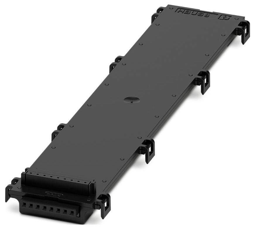 A rectangular black panel with connectors on the edges, likely a hardware component. The word 'FIBARO' is visible on top.