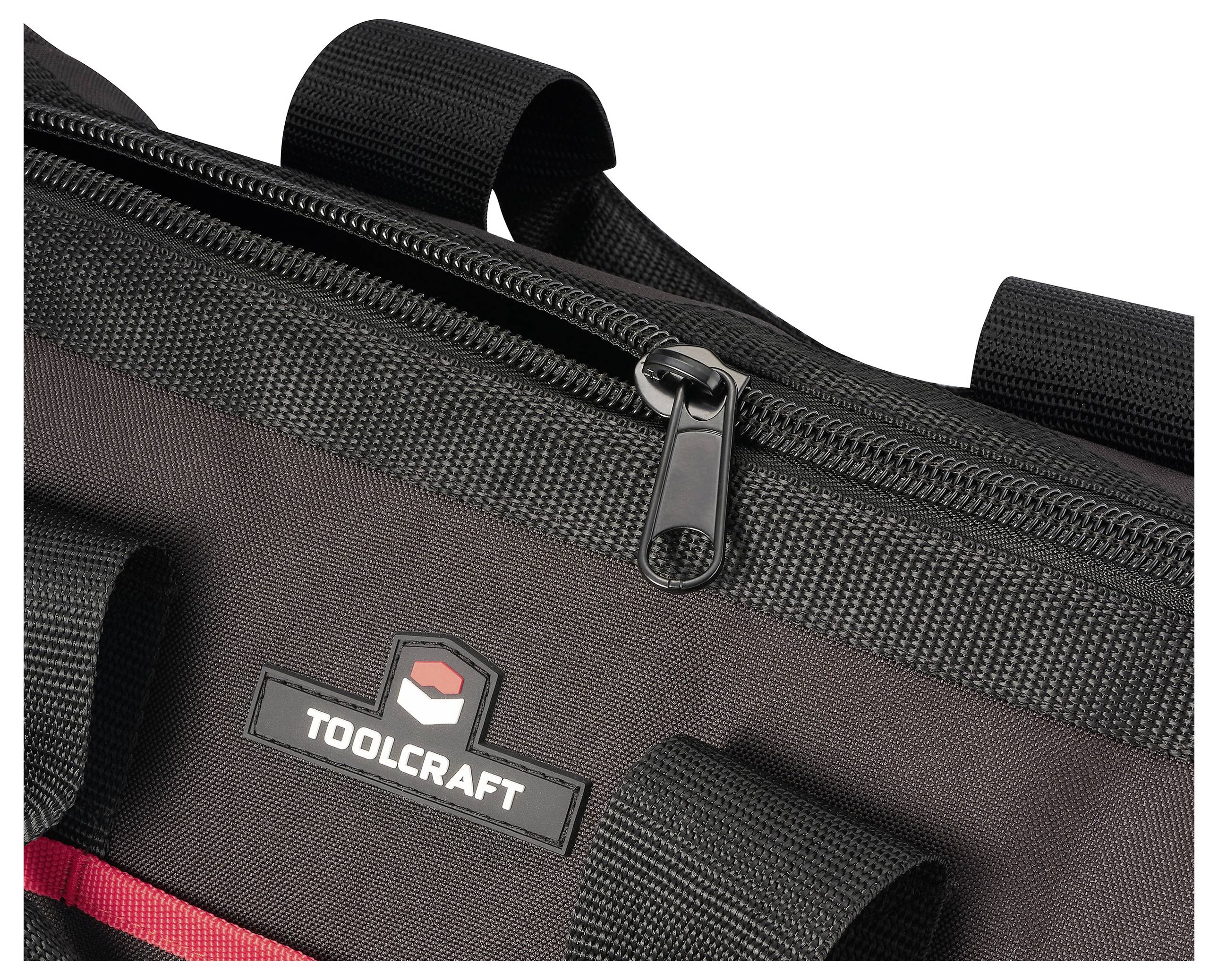 TOOLCRAFT-Werkzeugtasche in Schwarz mit teilweise geöffnetem Reißverschluss, die robuste Konstruktion und rote Akzente zeigt.