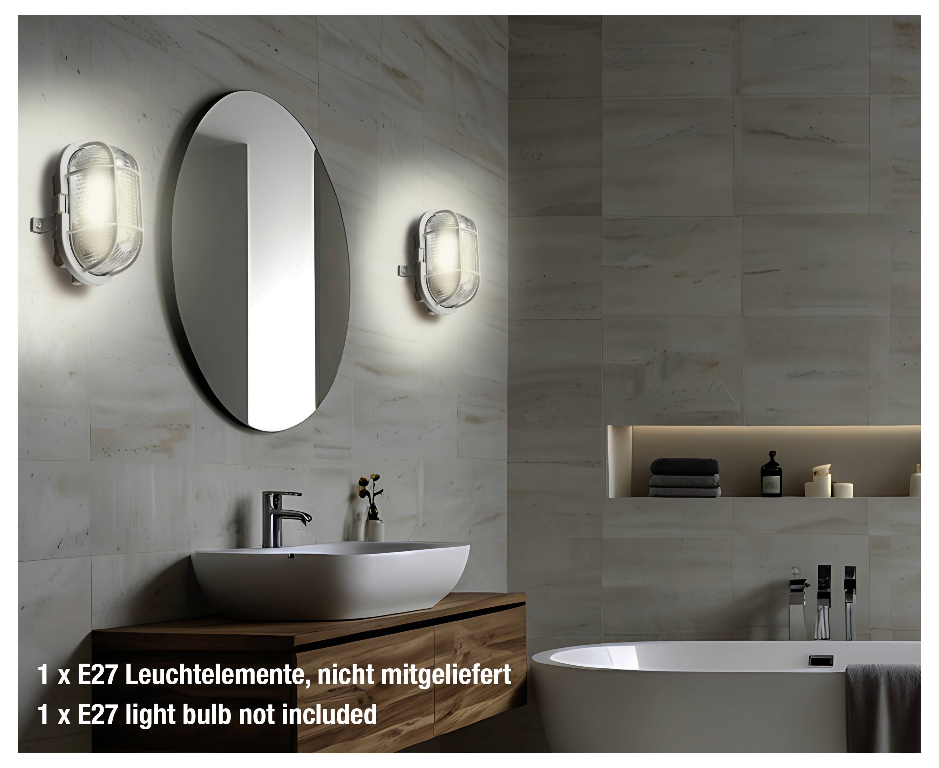 Badezimmereinrichtung mit einem modernen Waschbecken unter einem ovalen Spiegel, beleuchtet durch zwei Wandleuchten. Eine Badewanne befindet sich im Vordergrund. Der Text besagt: „1 x E27-Glühbirne nicht enthalten