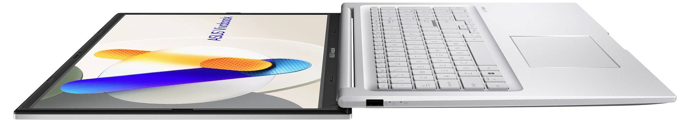 Ein weißer Laptop mit einer silbernen Tastatur neben einem Tablet, das farbenfrohe Formen zeigt, beide auf einer Oberfläche liegend, von der Seite betrachtet.