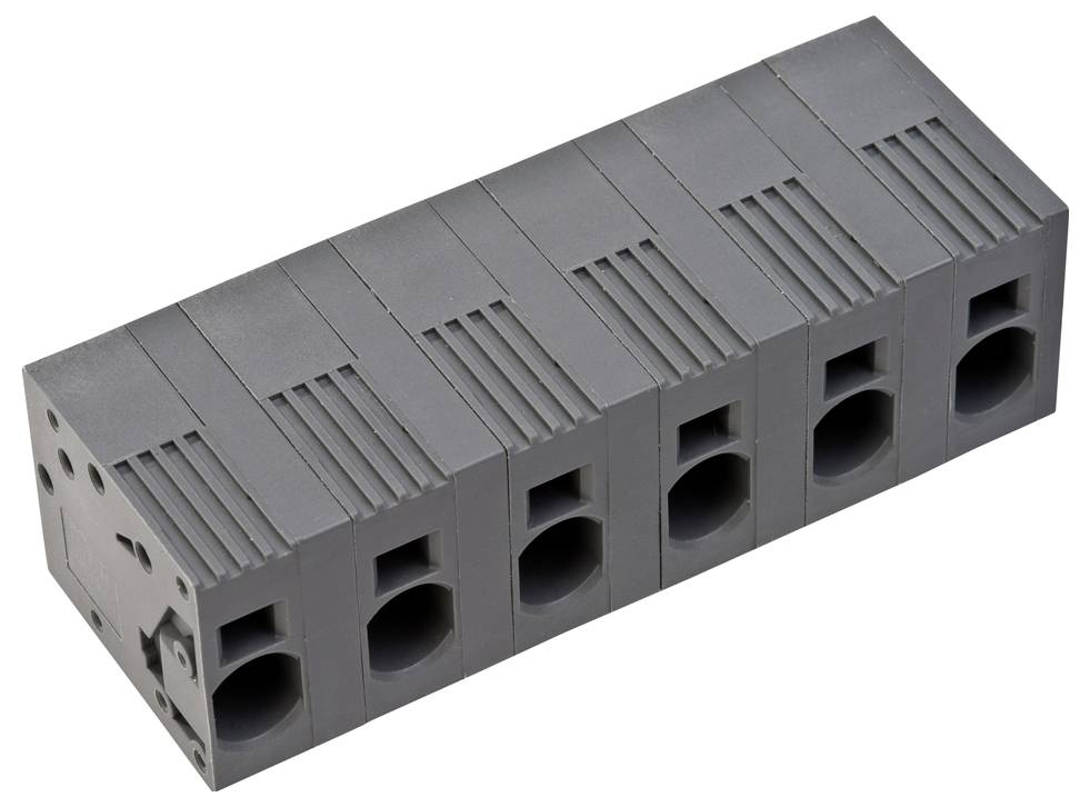 Ein graues modulares Klemmleistenblock mit sechs Anschllusspunkten, das für sichere elektrische Verdrahtung in Industrieumgebungen verwendet wird.