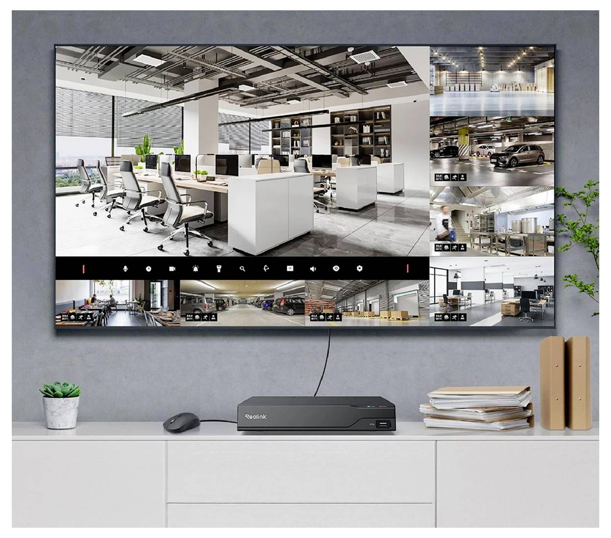 Ein Mehrfach-Sicherheitsbildschirm zeigt verschiedene Überwachungsaufnahmen, darunter Büroräume und eine Garage. Ausrüstung ist unterhalb des Bildschirms sichtbar.