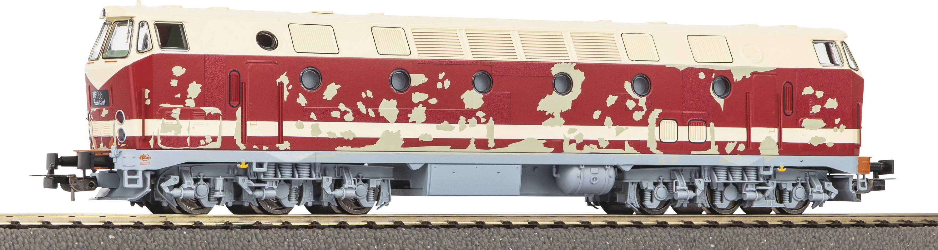Modelleisenbahn mit einem rot-beige Tarnmuster auf einem Gleis, mit stromlinienförmigem Design und sechs Rädern.