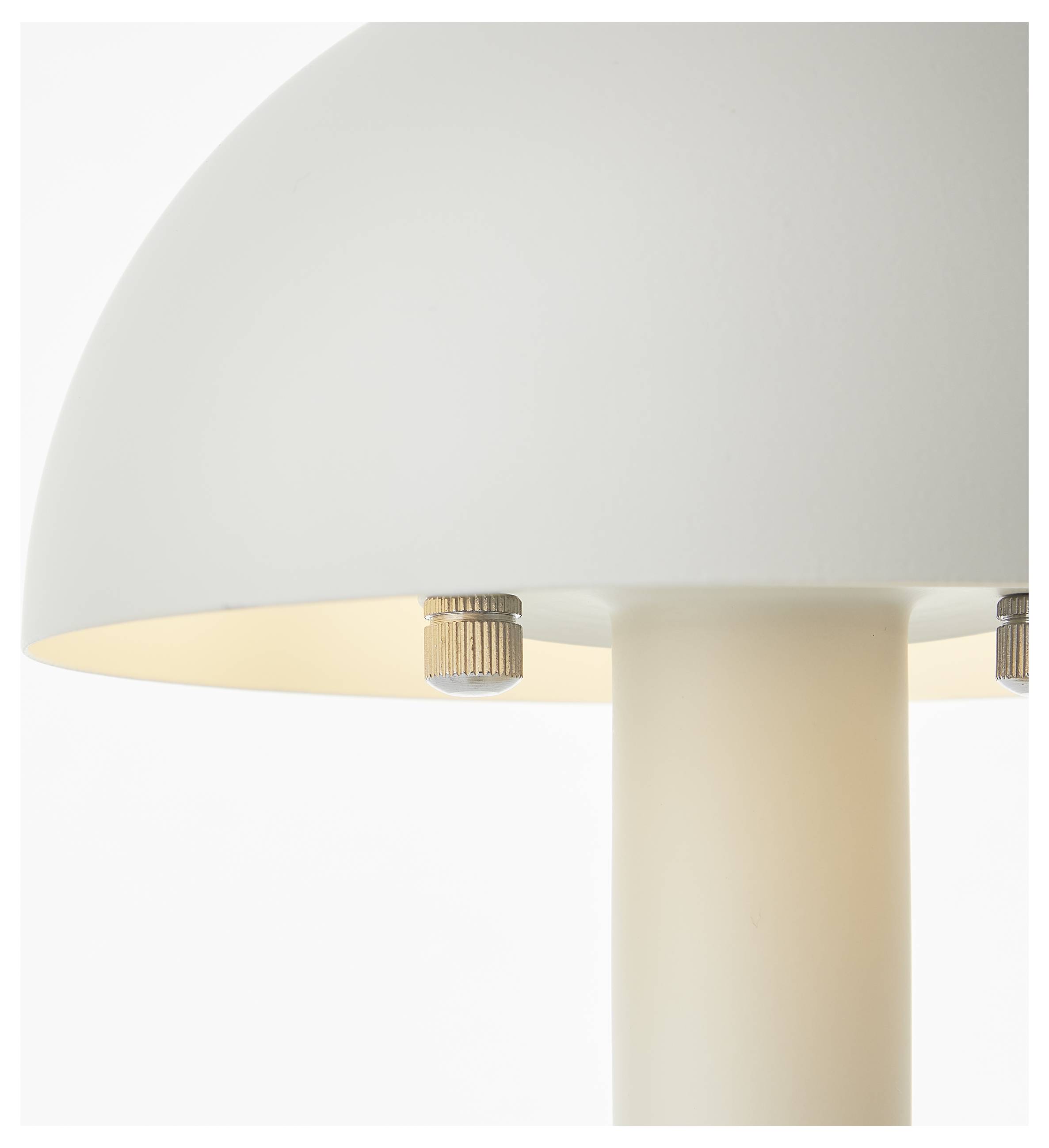 Eine Nahaufnahme einer modernen weißen Lampe mit einem kuppelförmigen Lampenschirm und einem zylindrischen Sockel, sanft von unten beleuchtet.