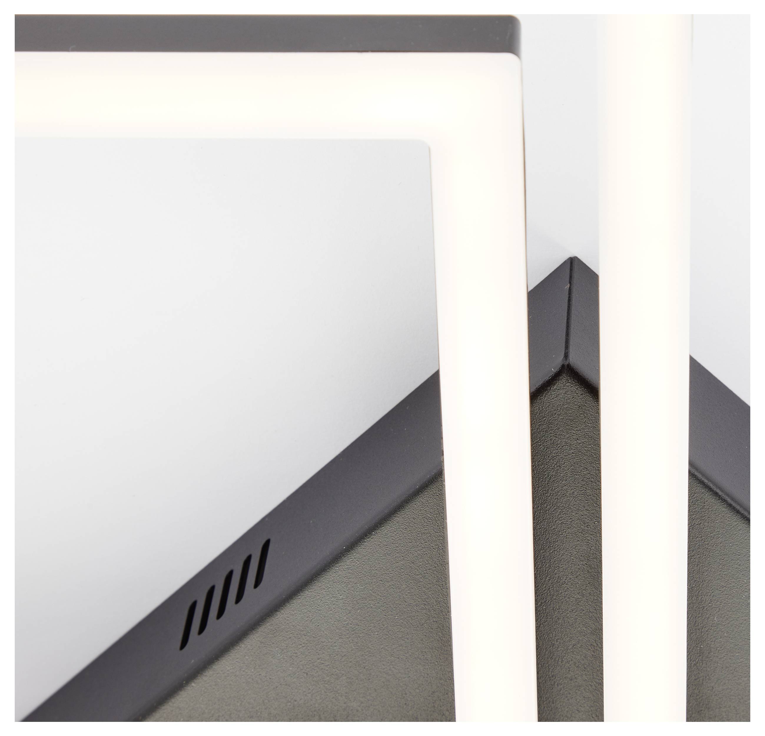 Nahaufnahme einer modernen LED-Leuchte mit geometrischem Design, die sich kreuzende Rahmen und einen schlanken, minimalistischen Finish aufweist.