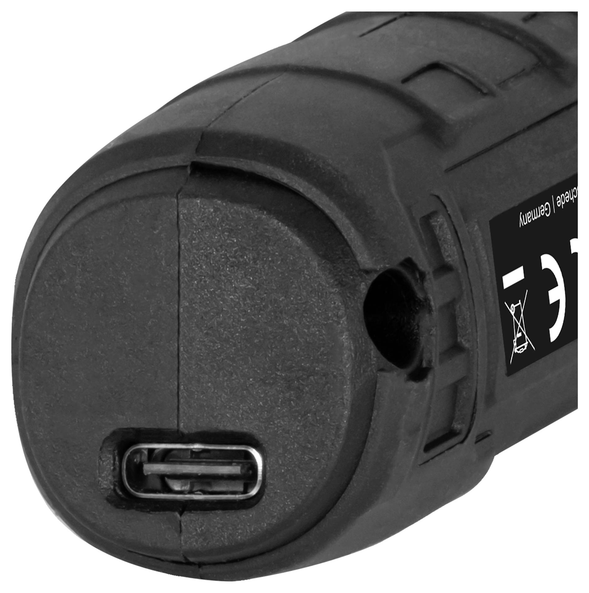 Nahaufnahme eines schwarzen zylindrischen elektronischen Geräts mit USB-C-Anschluss und teilweise sichtbarem CE-Zertifizierungsetikett.