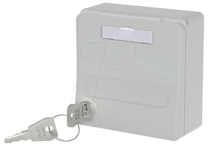 Ein grauer Schlüsseltresor mit einem in das Schloss eingesteckten Schlüssel, ein weiterer Schlüssel mit Schlüsselring liegt daneben und deutet auf Sicherheit oder Zugriffskontrolle hin.