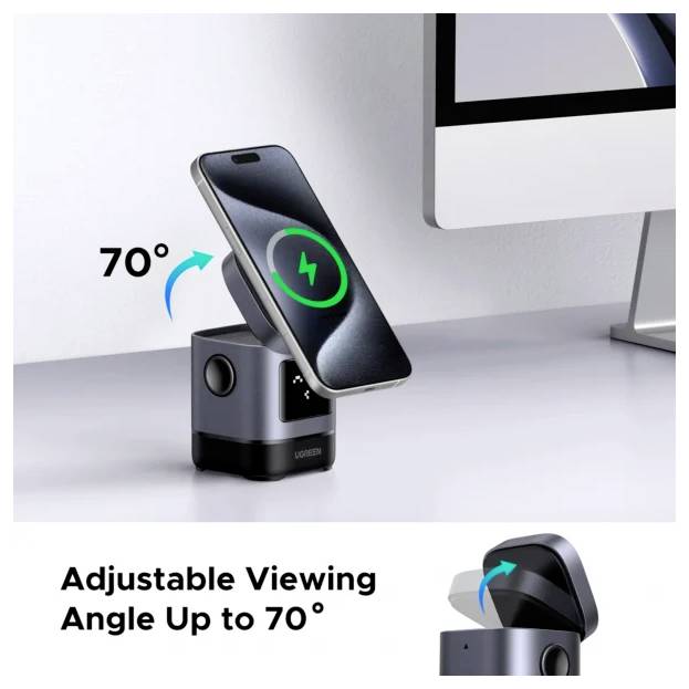 Ein Smartphone lädt sich auf einer schwarzen Dockingstation mit verstellbarem Winkel bis zu 70 Grad neben einem Computermonitor auf.