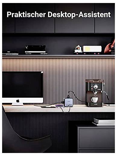 Ein Schreibtisch mit Computer, Kaffeekocher und Desktop-Assistent in modernem Büro. Oben steht 'Praktischer Desktop-Assistent'.