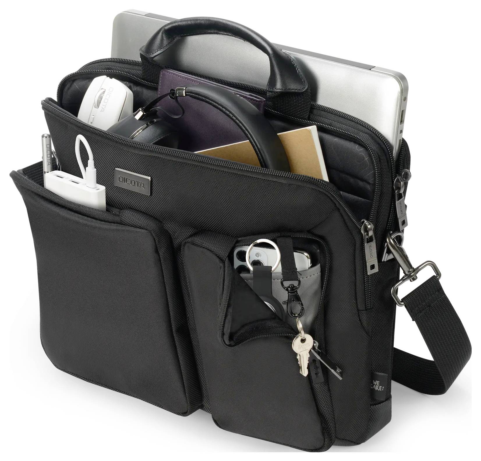 Eine schwarze Technik-Organizer-Tasche mit mehreren Fächern fasst einen Laptop, Kopfhörer, ein Smartphone und verschiedene kleine Gadgets und Zubehör.