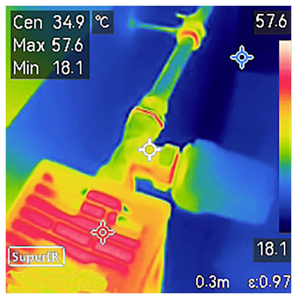 Thermalbild mit einem Temperaturbereich von 18,1°C bis 57,6°C. Zentraler Fokus bei 34,9°C auf einer mechanischen Komponente mit Wärmegradient.