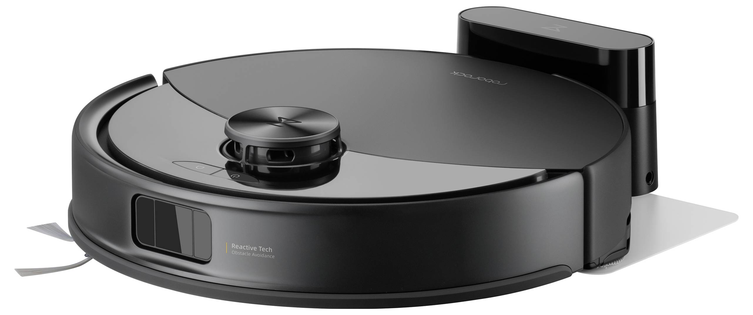 Ein schwarzer Roboterstaubsauger auf einer weißen Oberfläche, mit einer Ladestation dahinter. Der Staubsauger hat eine kreisförmige Form und Sensoren auf der Oberseite.