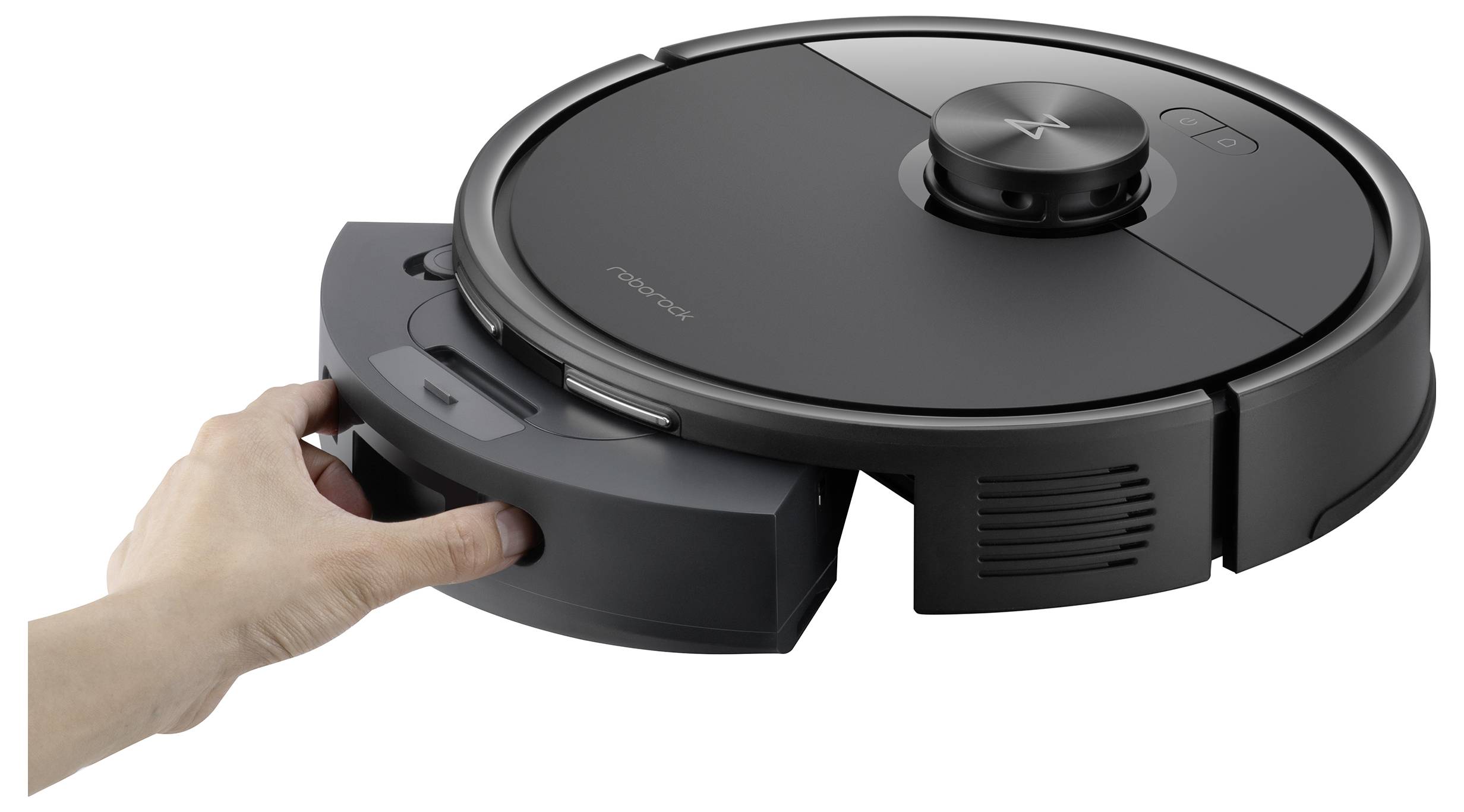 Eine Person setzt einen Mülleimer in einen schlanken, kreisförmigen Roboterstaubsauger ein.