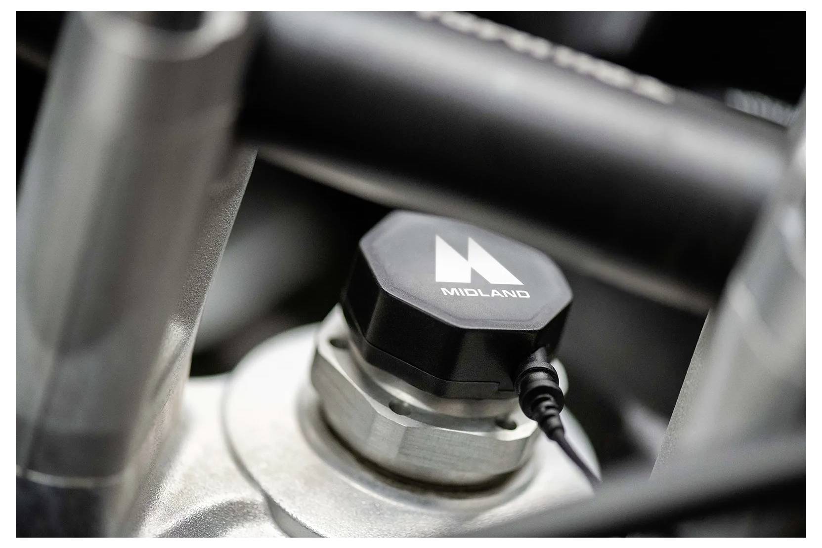 Eine Nahaufnahme einer mechanischen Komponente mit einer schwarzen Kappe mit der Aufschrift „MIDLAND