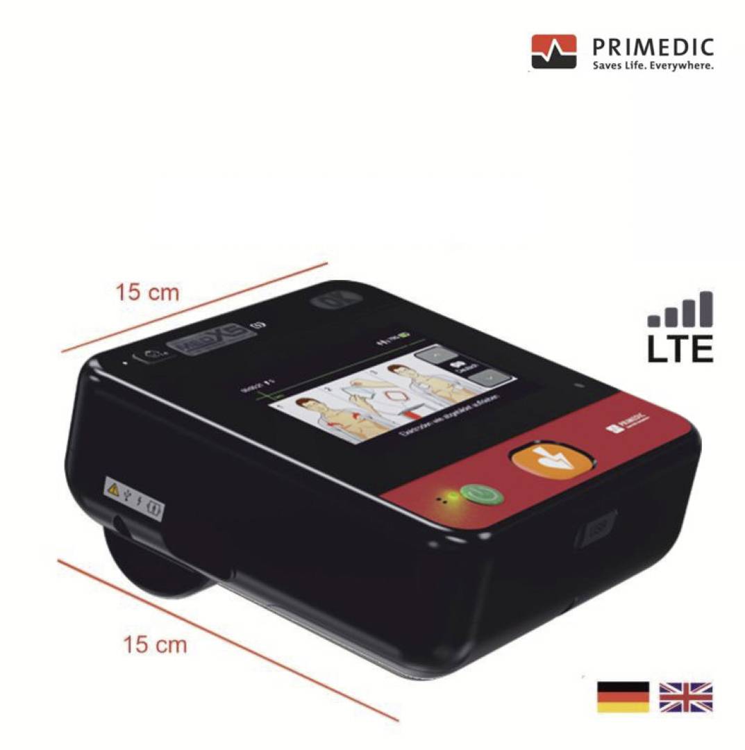 Ein Defibrillator mit digitalem Display, das eine Benutzeranleitung zeigt, das Logo „Rettet Leben. Überall