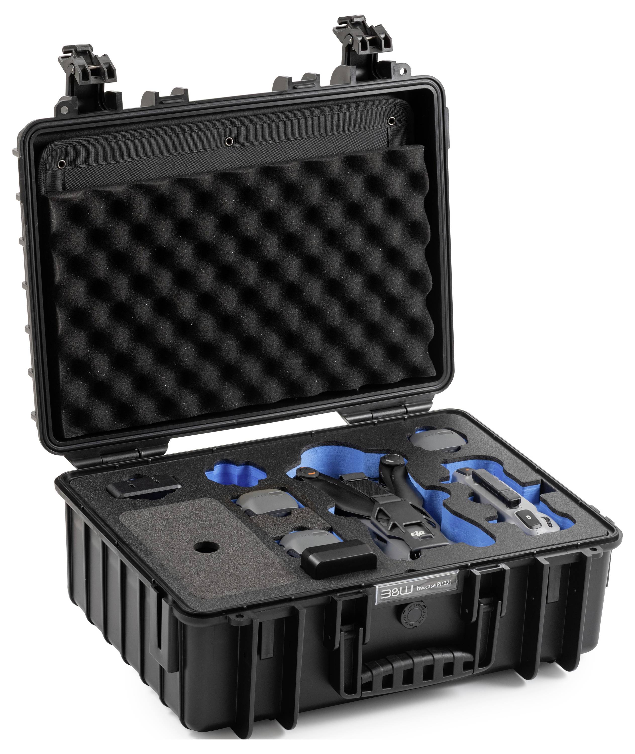 Ein offenes schwarzes Schutzgehäuse mit Schaumstoffinnenseite hält verschiedene blaue und schwarze Ausrüstungskomponenten sicher an ihrem Platz, die ordentlich im Inneren angeordnet sind.