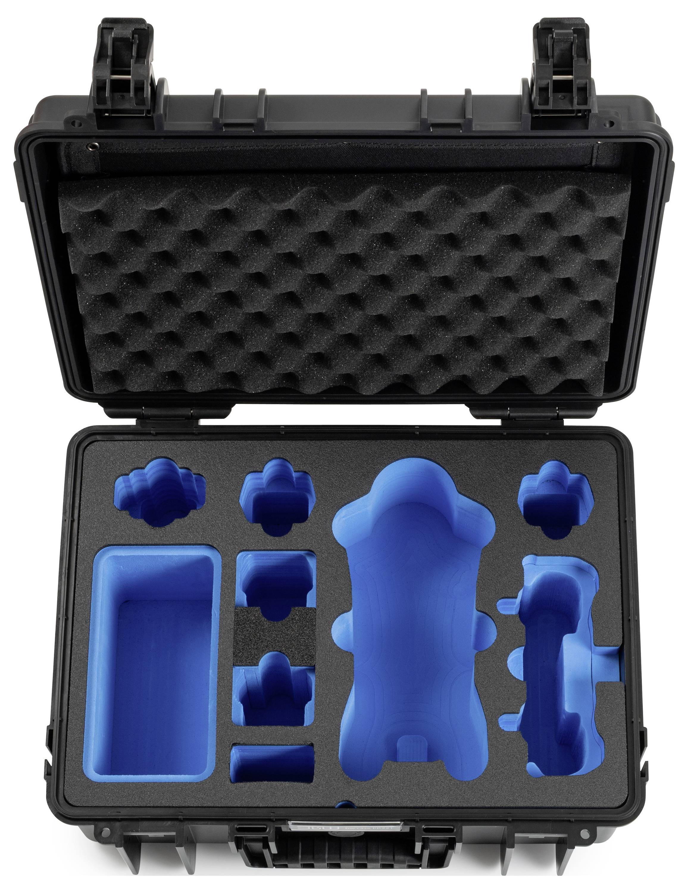 Ein offener schwarzer Schutzkoffer mit maßgefertigten blauen Schaumstoffeinlagen, die verschiedene Gegenstände sicher halten, von oben betrachtet.