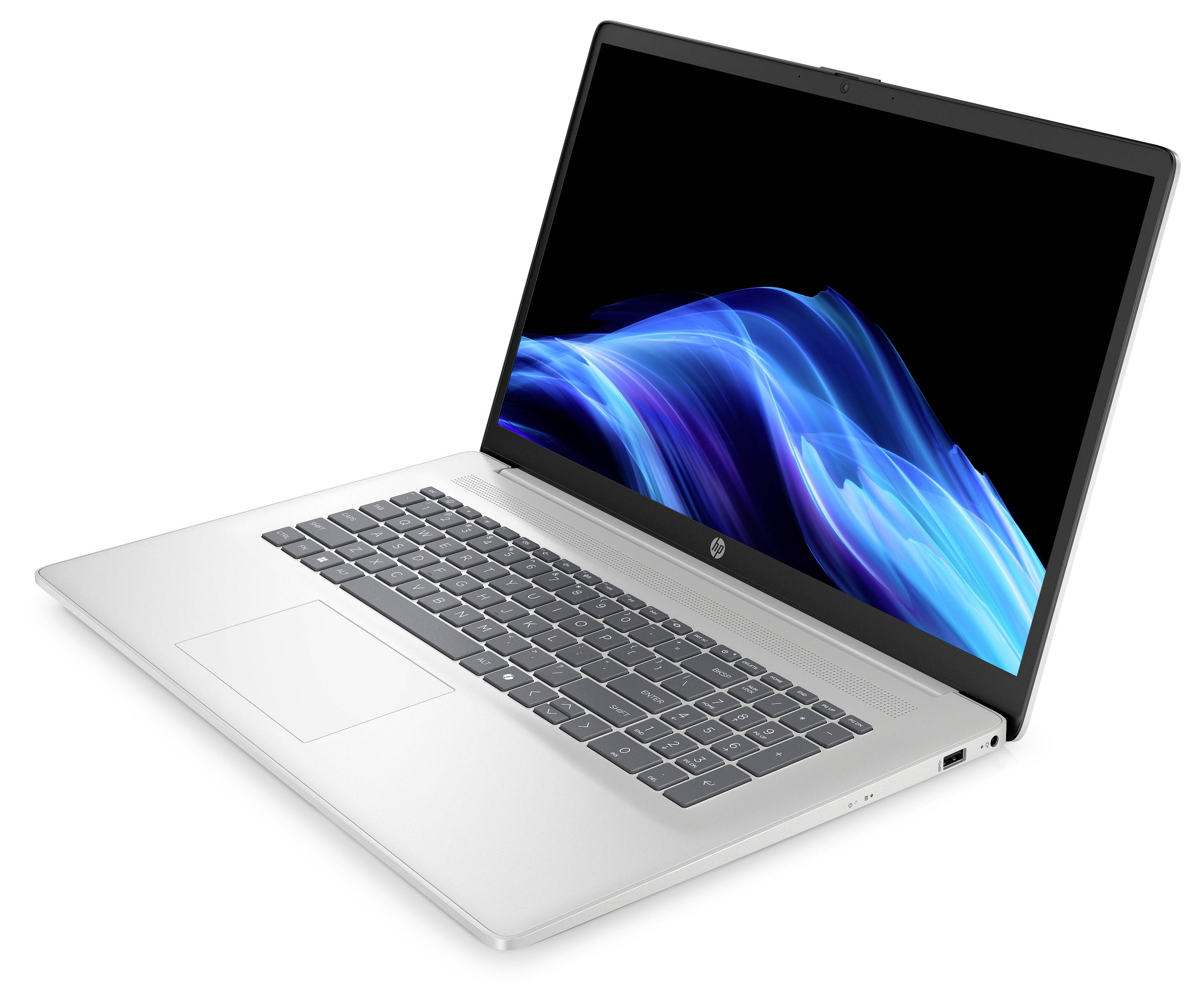 Ein silberner Laptop mit einer beleuchteten Tastatur und einem lebendigen, blauen abstrakten Design auf dem Bildschirm, von einem Seitenwinkel aus gezeigt.