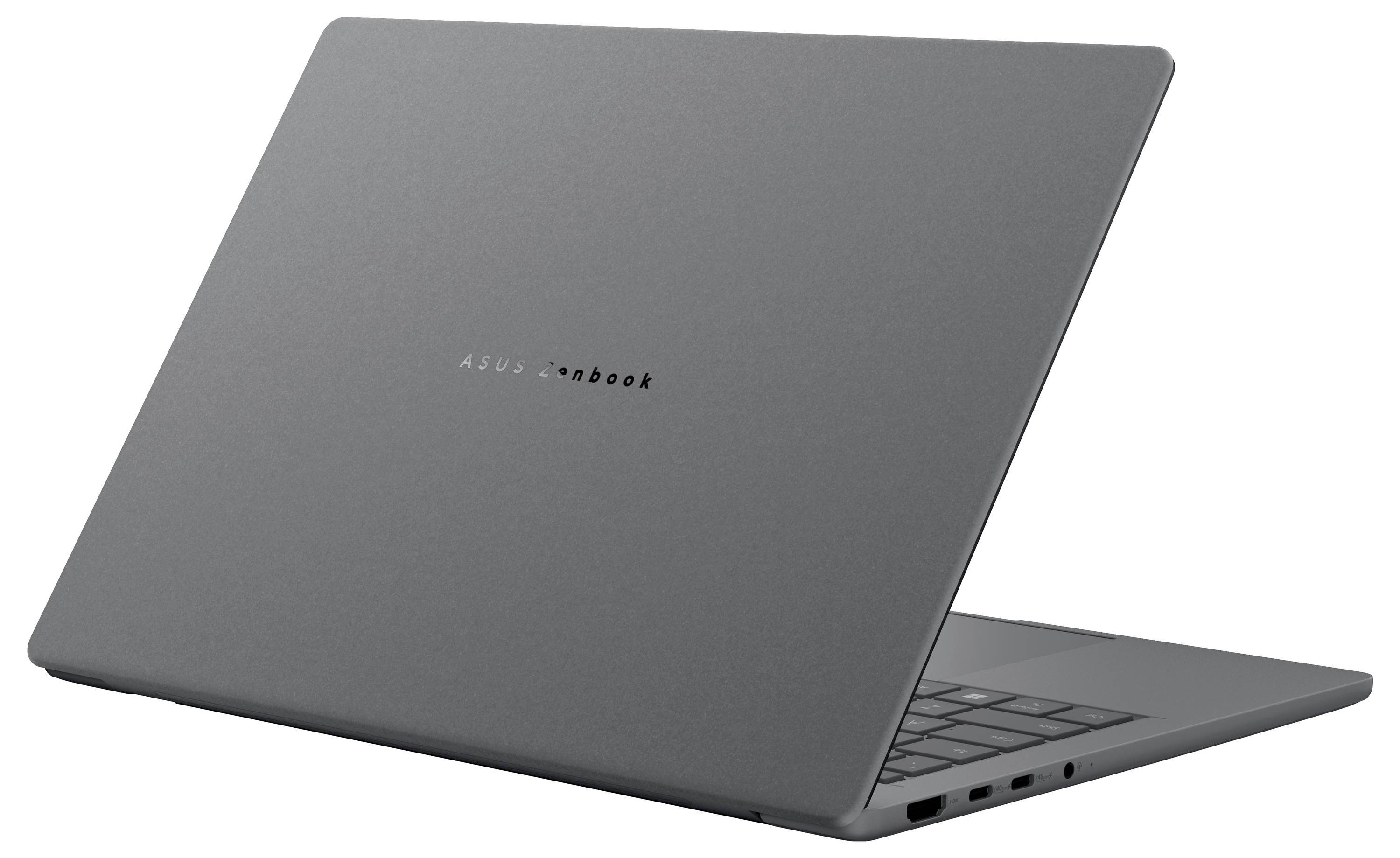 Ein eleganter, geschlossener Laptop mit minimalistische grauem Design, das die kompakte Form und das leichte Profil des Geräts zeigt, von einem Winkel aus betrachtet.