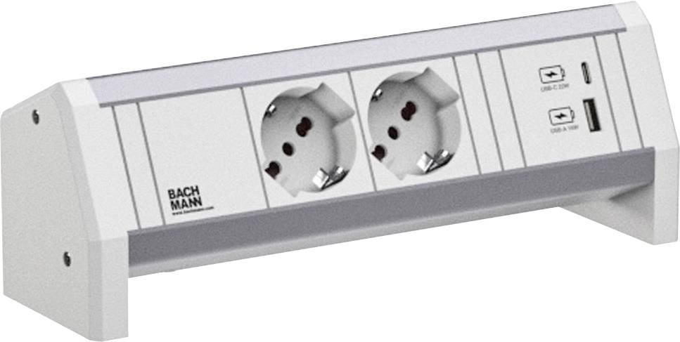Mehrfachsteckdose mit zwei europäischen Steckdosen und zwei USB-Anschlüssen auf einem minimalistischen weißen Ständer.