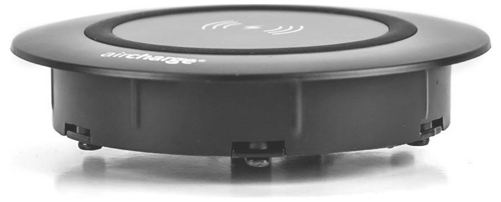 Ein rundes, schwarzes kabelloses Ladegerät mit einem subtilen Symbol auf der Oberseite, das die Ladefähigkeit anzeigt. Es ist dafür ausgelegt, in Oberflächen eingebettet zu werden.