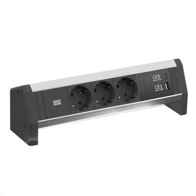Eine Steckerleiste mit drei runden Steckdosen und zwei USB-Anschlüssen, geeignet zum gleichzeitigen Laden mehrerer Geräte.