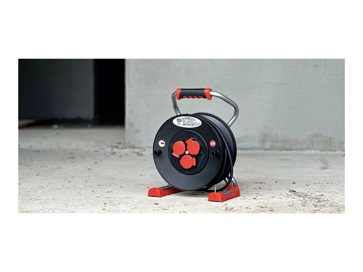 Tragbare Kabelrolle in Schwarz und Rot mit drei roten Steckdosen und einem robusten Griff zum einfachen Transport.