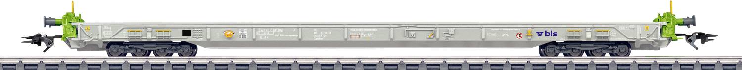 Ein futuristisches Transportfahrzeug auf Schienen, mit einem schlanken Design mit grünen Akzenten und Antennen an jedem Ende.