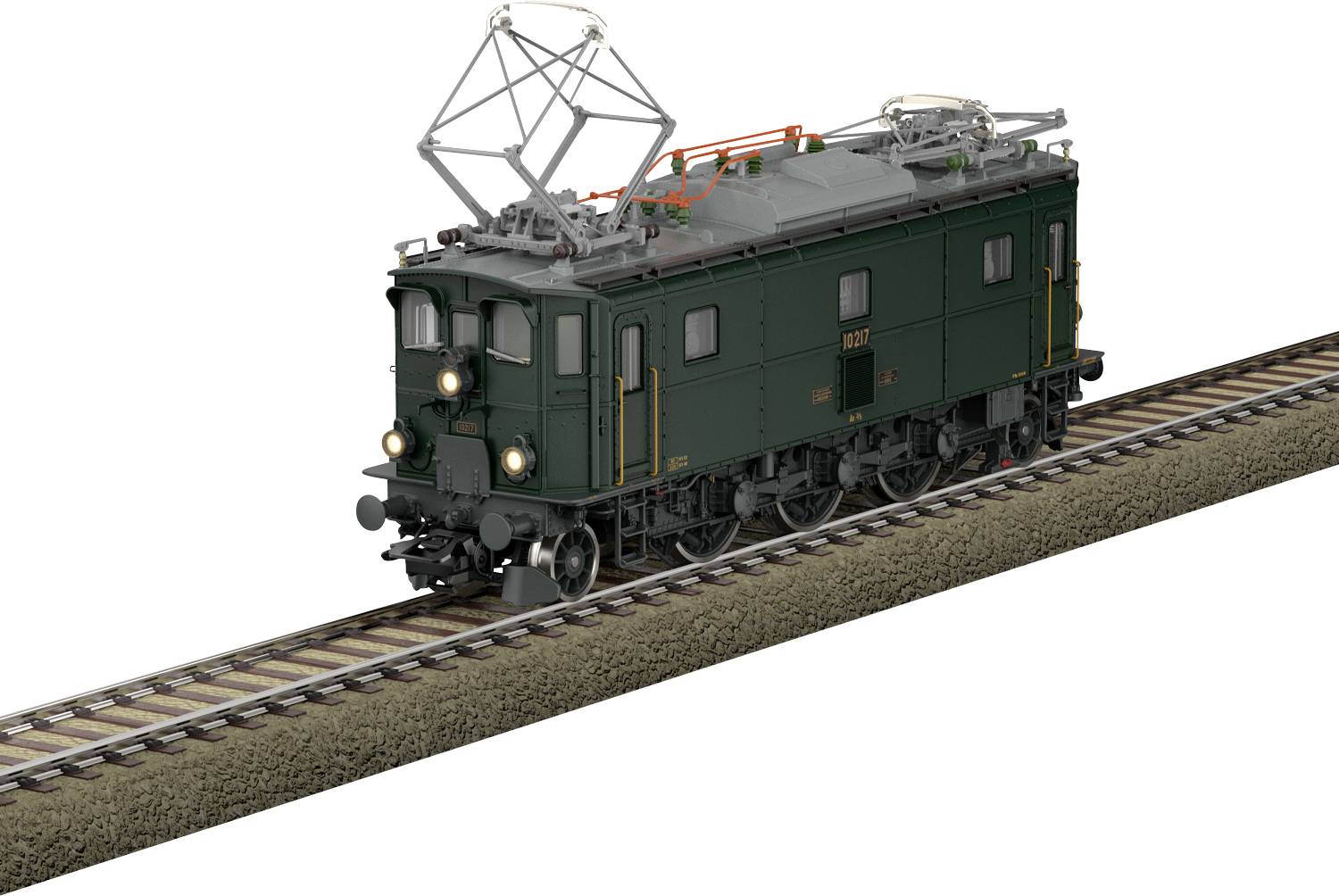 Eine grüne, vintage-elektrische Lokomotive, die auf einem einzelnen Eisenbahngleis fährt und über Stromabnehmer sowie mehrere Frontscheinwerfer verfügt.