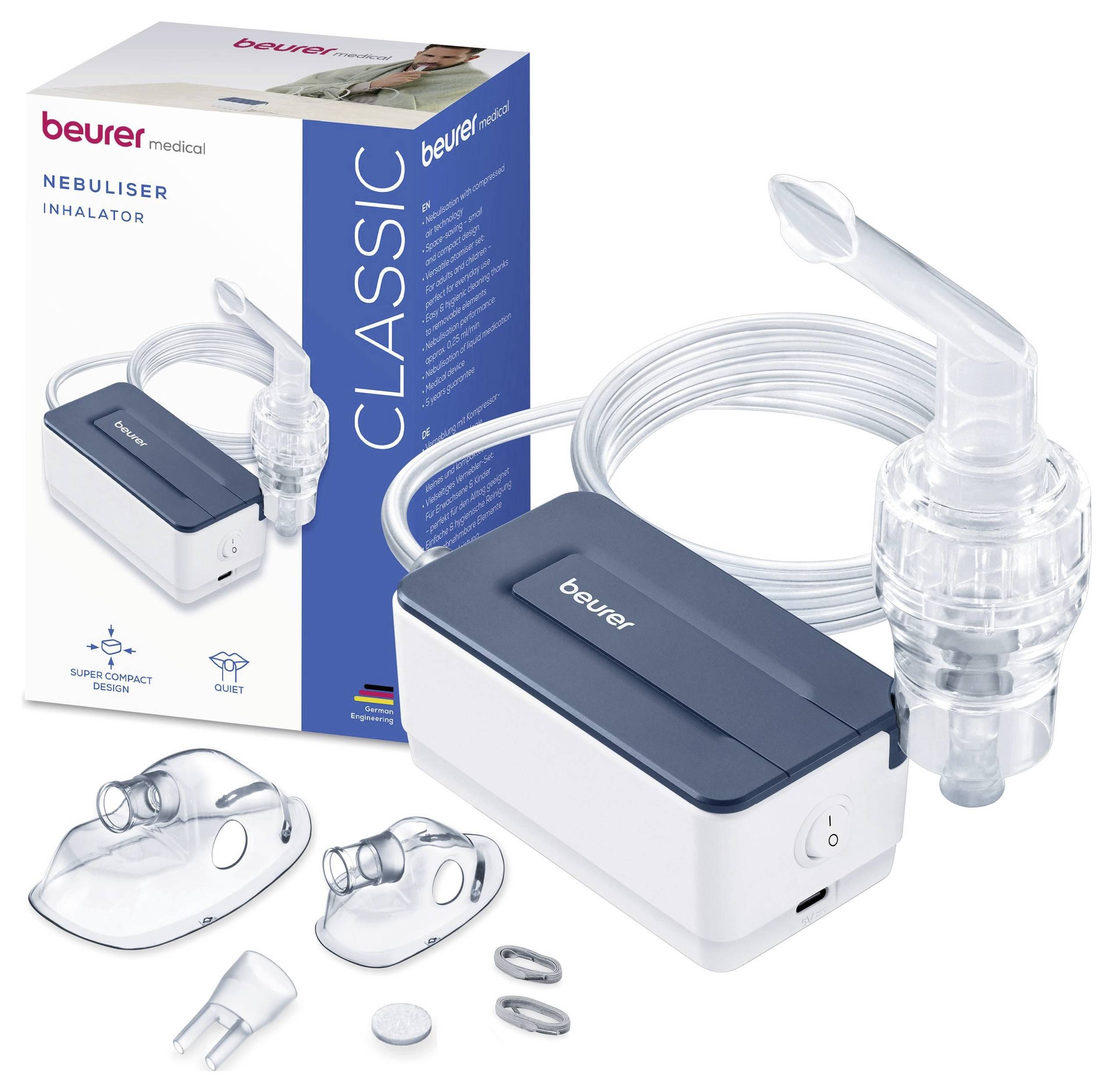 Ein kompakter weiß-blauer Vernebler mit Mundstücken, Masken und Schläuchen neben seiner Verpackung mit der Beschriftung „Beurer Classic Nebuliser Inhalator