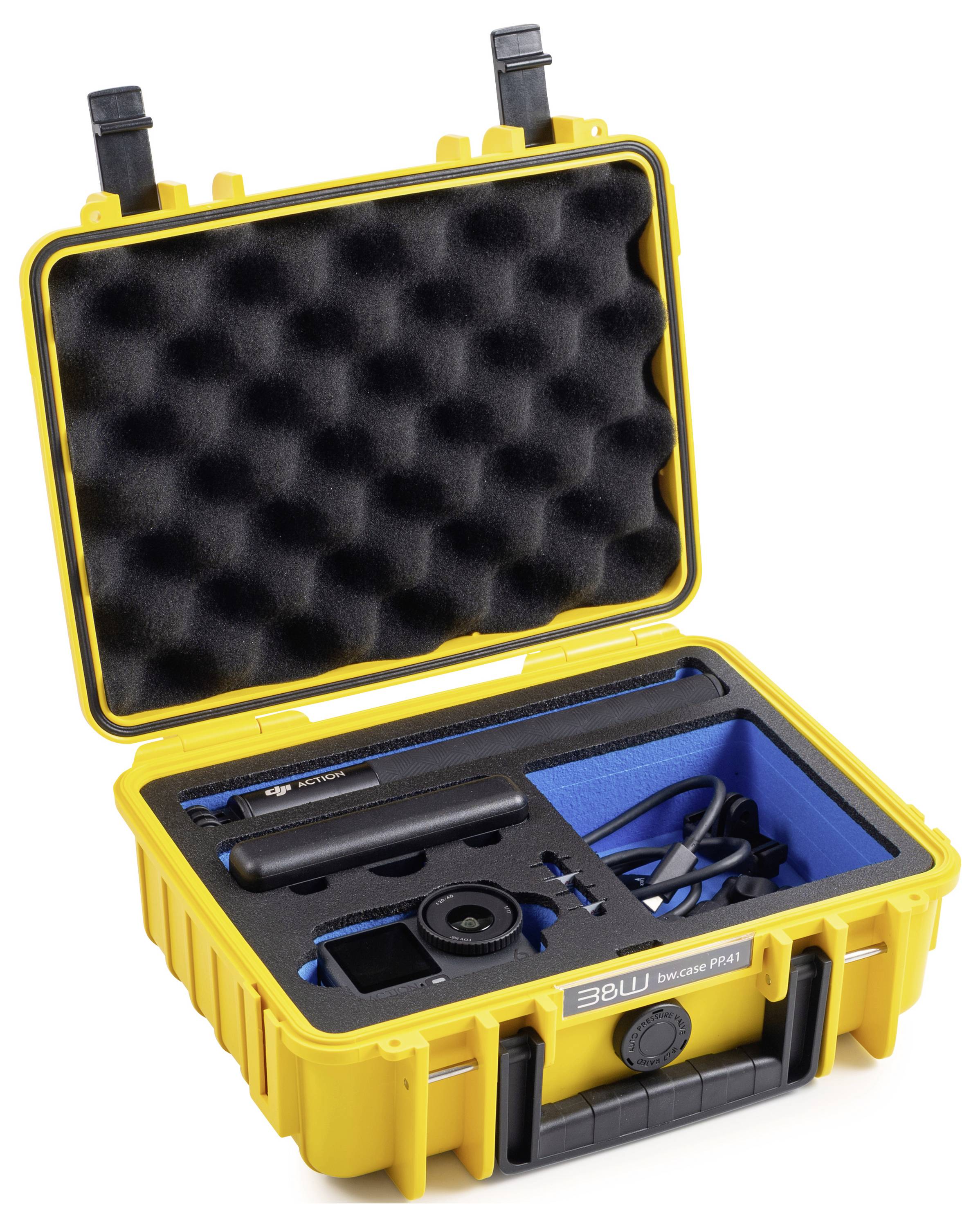 Ein robustes gelbes Gehäuse mit Schaumstoffauskleidung enthält elektronische Ausrüstung, einschließlich eines Mikrofons und Kabeln, die in blauen Fächern organisiert sind.