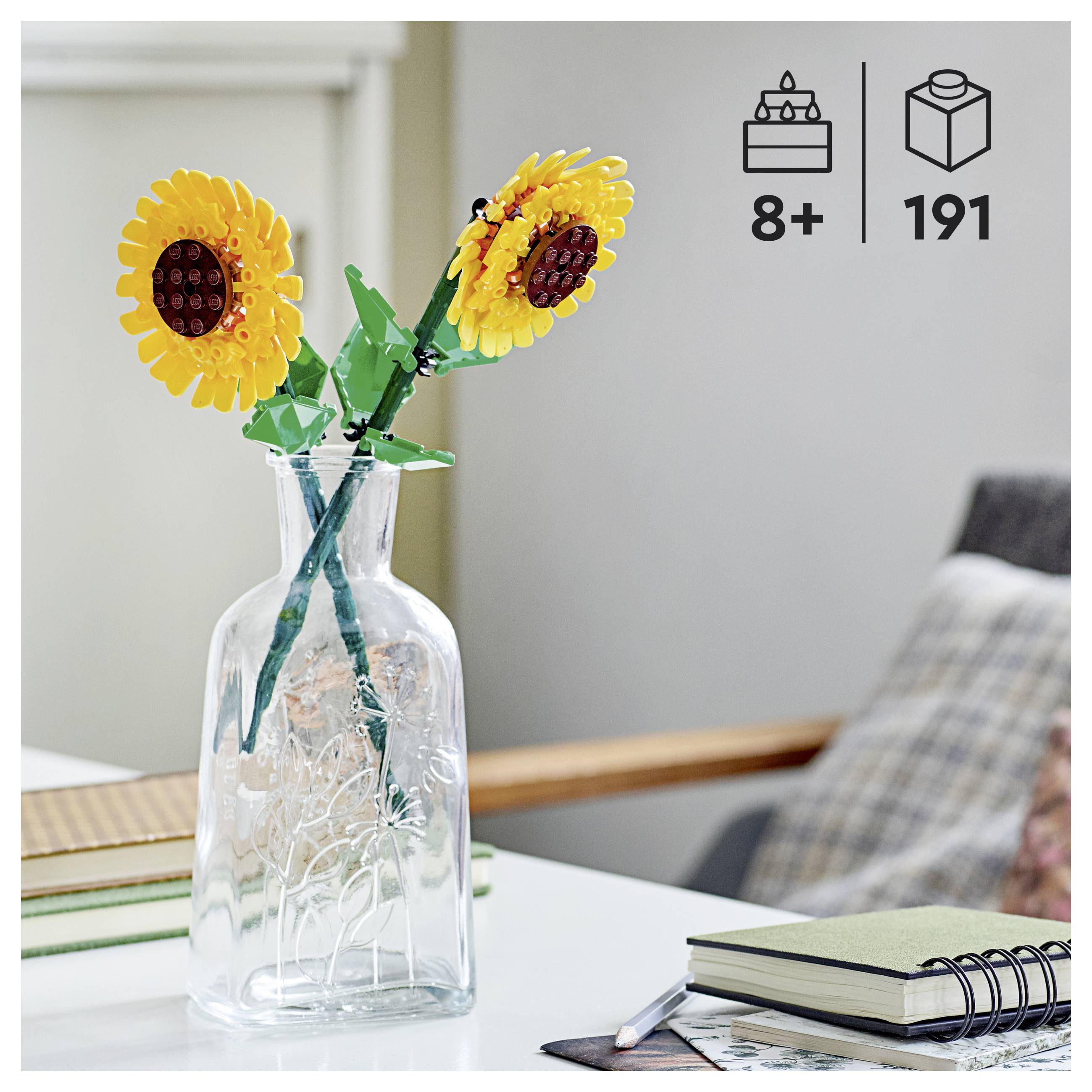 Two yellow Lego sunflower models in a transparent vase on a table. '8+' age and '191' pieces icons show suitability for ages 8 and up.