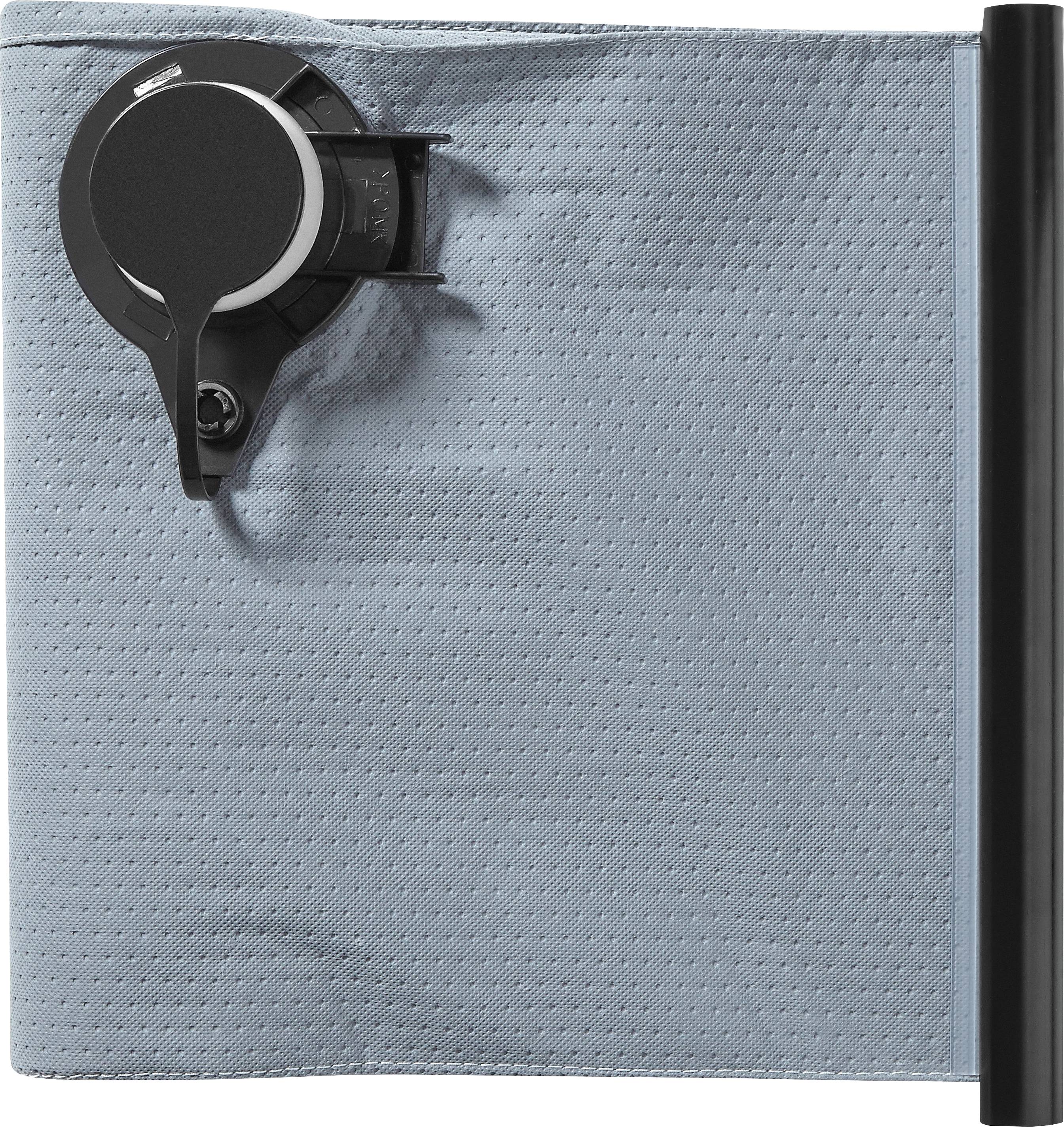 Eine grau strukturierte Oberfläche mit einem schwarzen kreisförmigen Gerät, das angebracht ist und einem abstrakten Uhrmechanismus-Design auf Stoff ähnelt.