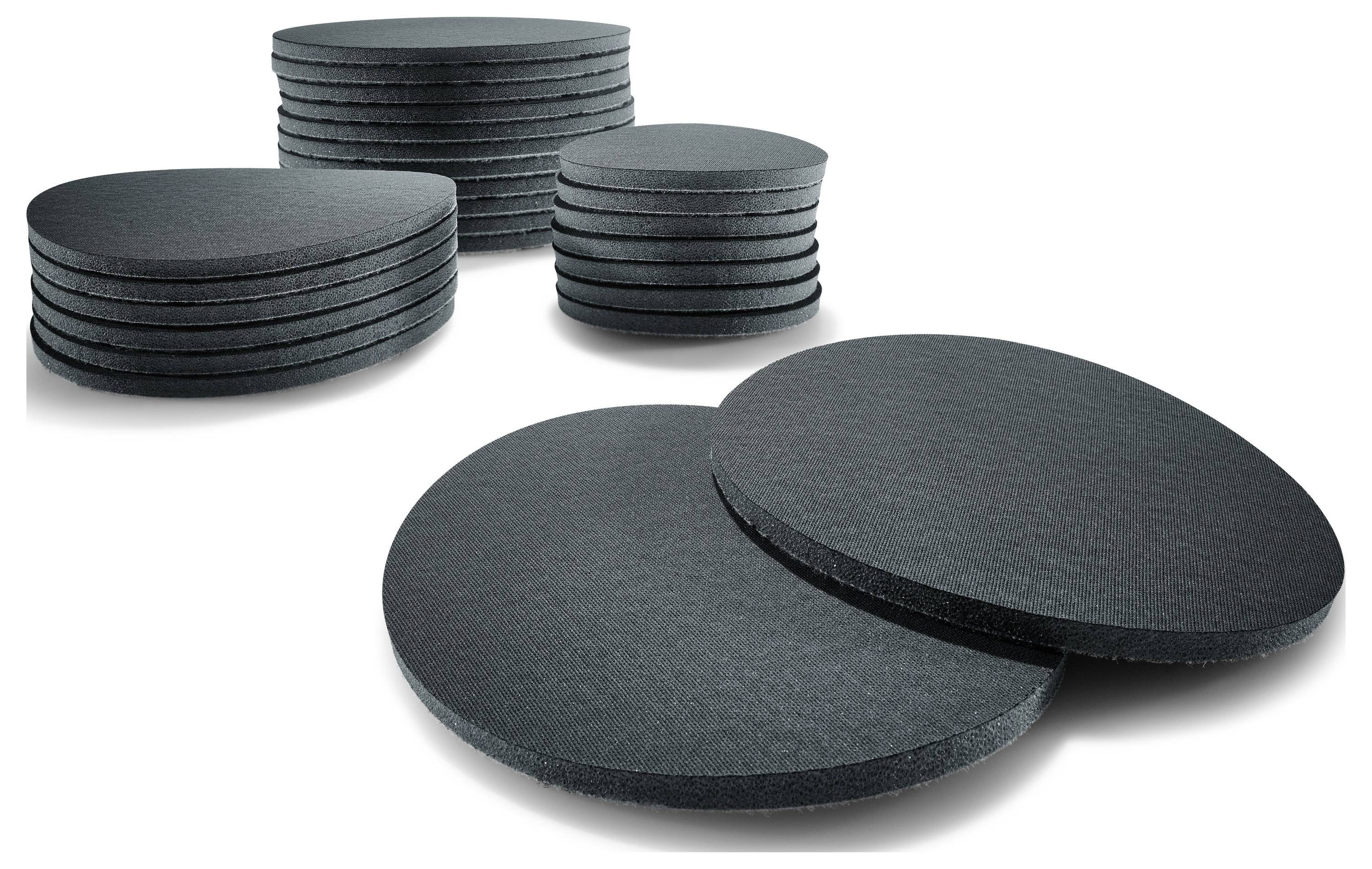 Runde schwarze Schaumstoffpolster in unterschiedlichen Stapeln und Größen, verwendet für Schalldämmungs- oder Polsterungsanwendungen.