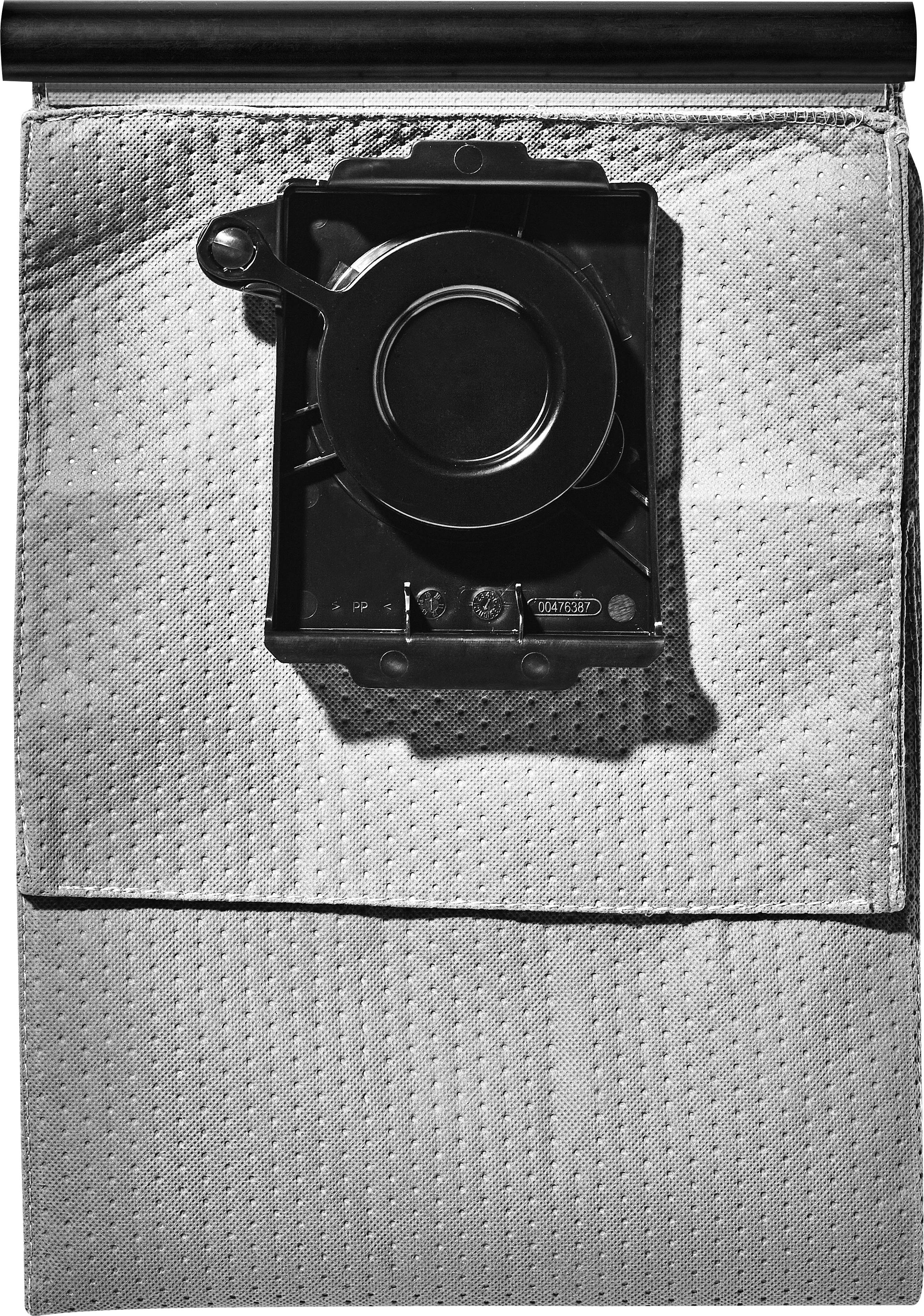 Eine strukturierte Lederfläche mit einer zentriert angebrachten schwarzen Metallfassung, die einen kreisförmigen Knopf und einen kleinen Hebel aufweist und einen industriellen Look erzeugt.