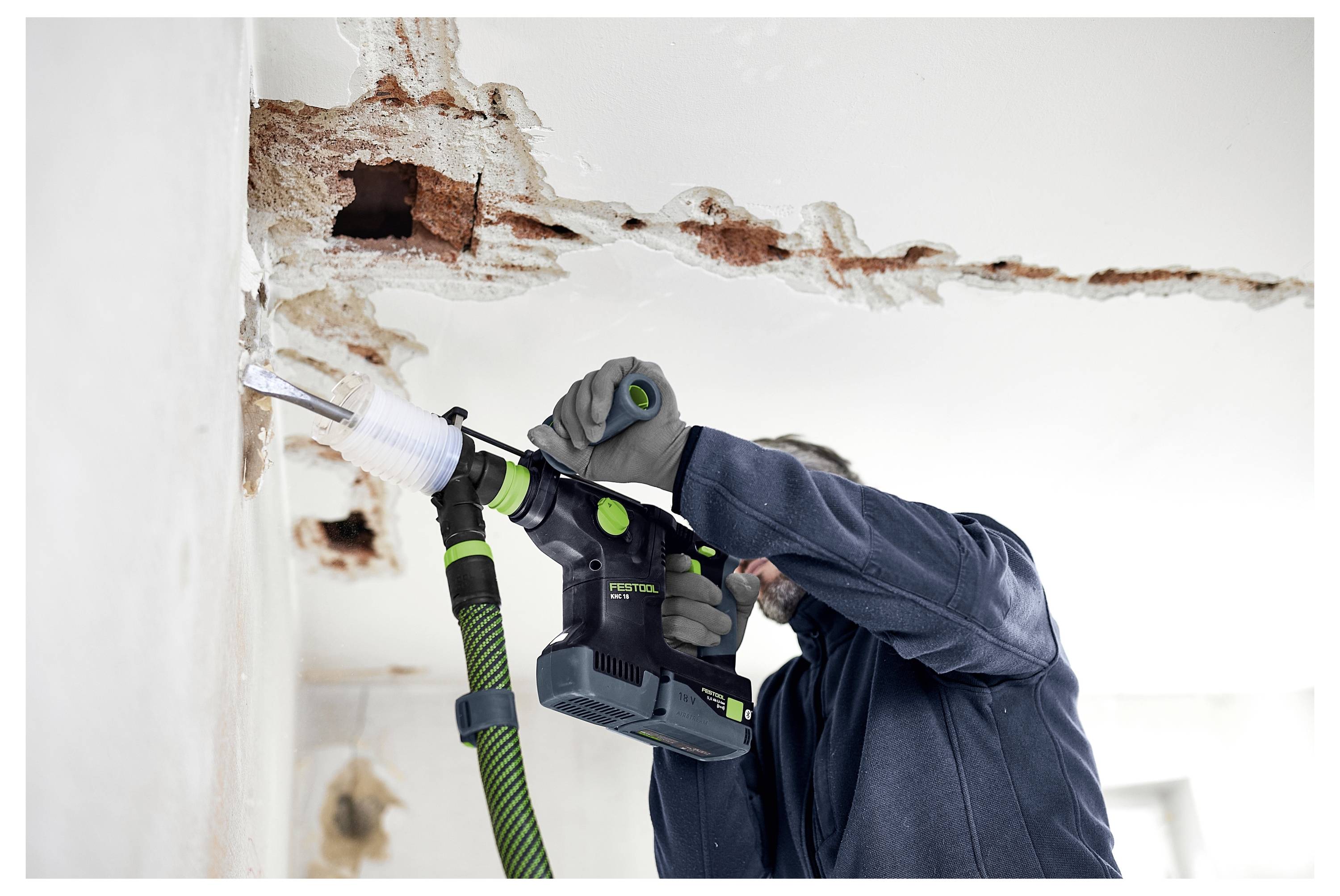 Ein Gaming-Monitor mit futuristischem Design, mit Teal- und Rosa-Akzenten, einem Kreismuster auf der Rückseite und dem Akronym „ROG