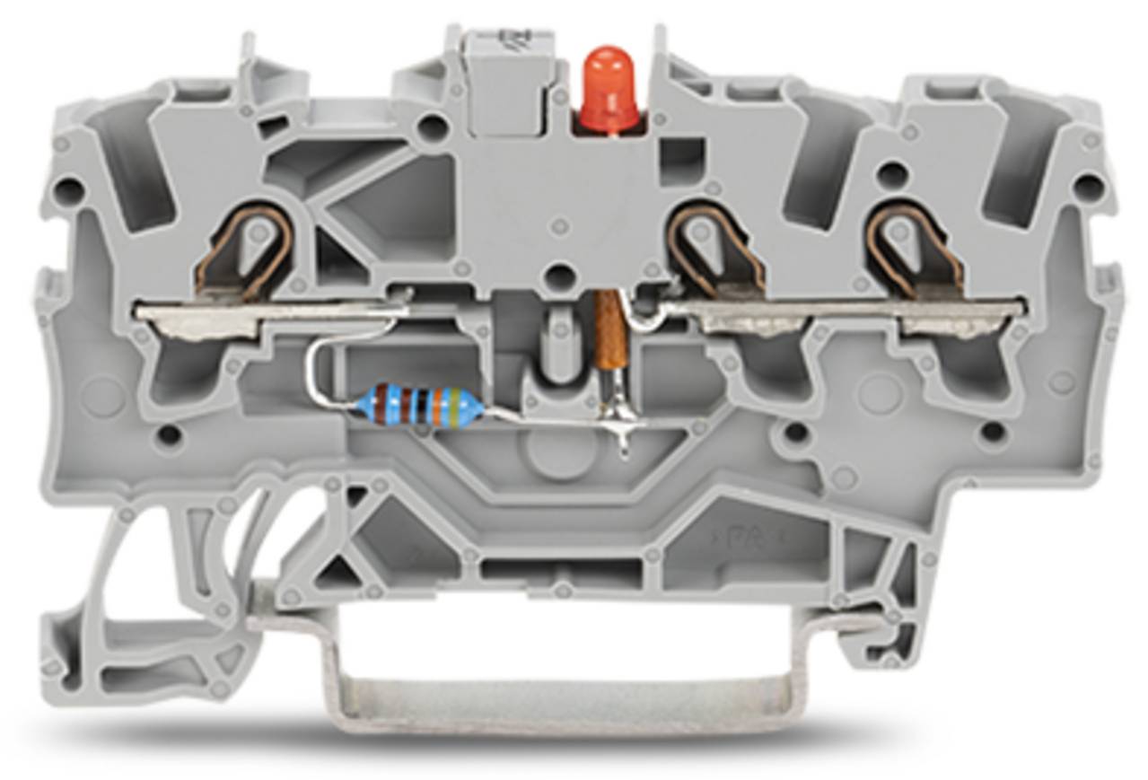 Ein graues elektrisches Klemmleistenblock mit sichtbarem roten Indikator, metallischen Anschlüssen und einem Widerstand in seiner Mitte.