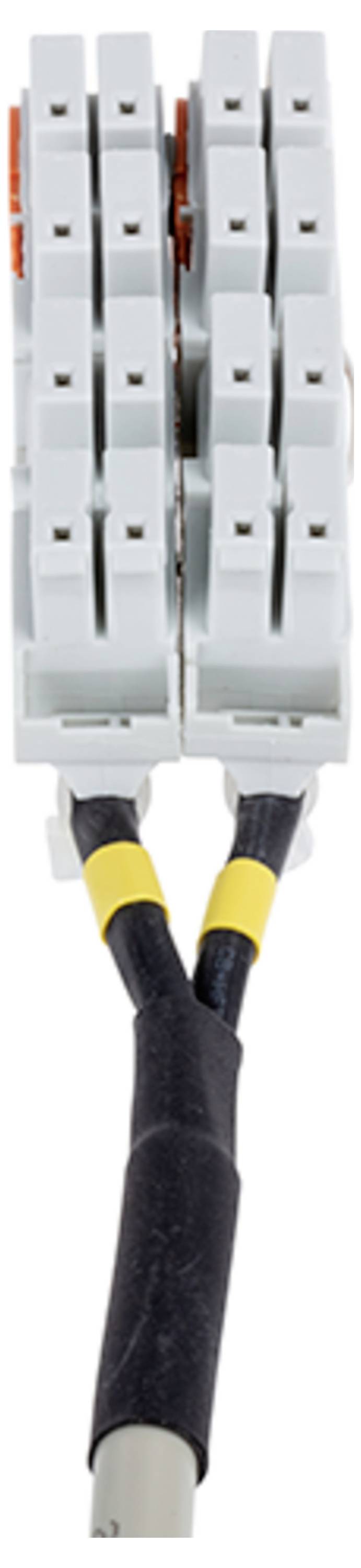 Nahaufnahme eines Drahtsteckers mit zwei Sätzen paralleler Anschlüsse und schwarzen Kabeln, umwickelt mit gelb-schwarzem Klebeband, für elektrische Verbindungen.