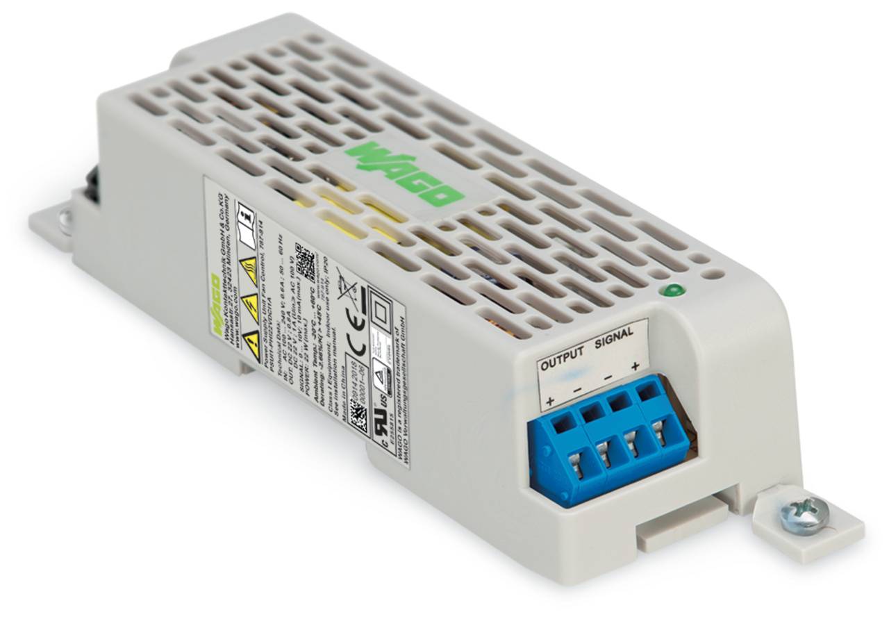 Ein beiges elektronisches Modul mit einem blauen Anschluss mit der Bezeichnung „OUTPUT SIGNAL