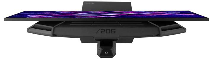 „Schwarzes rechteckiges Gerät mit abstraktem violett- und rosa Designmuster auf einem horizontalen Bildschirm, auf dem Sockel die Modellnummer /206 angezeigt.