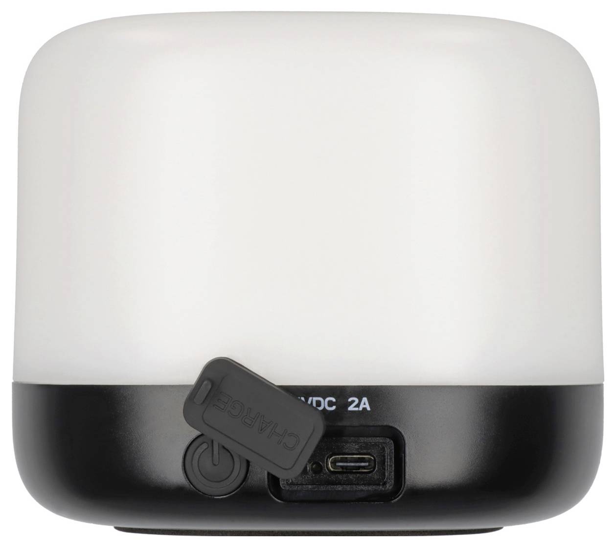 Eine kleine, zylindrische, tragbare LED-Lampe mit weißer Oberseite und schwarzer Basis, mit USB-Ladeanschluss und Einschaltknopf auf der Rückseite.