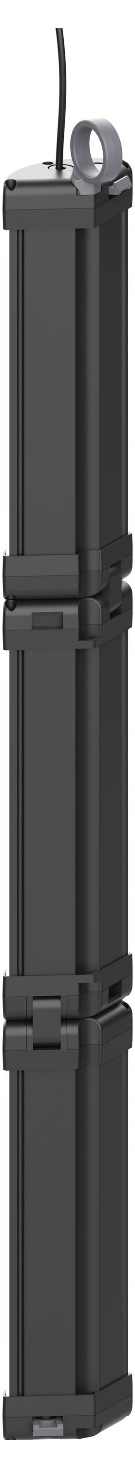 Eine hohe, schwarze, vertikale Struktur mit drei gestapelten rechteckigen Abschnitten, möglicherweise ein elektronisches Gerät oder Batteriepack, mit einem Kabel oben.