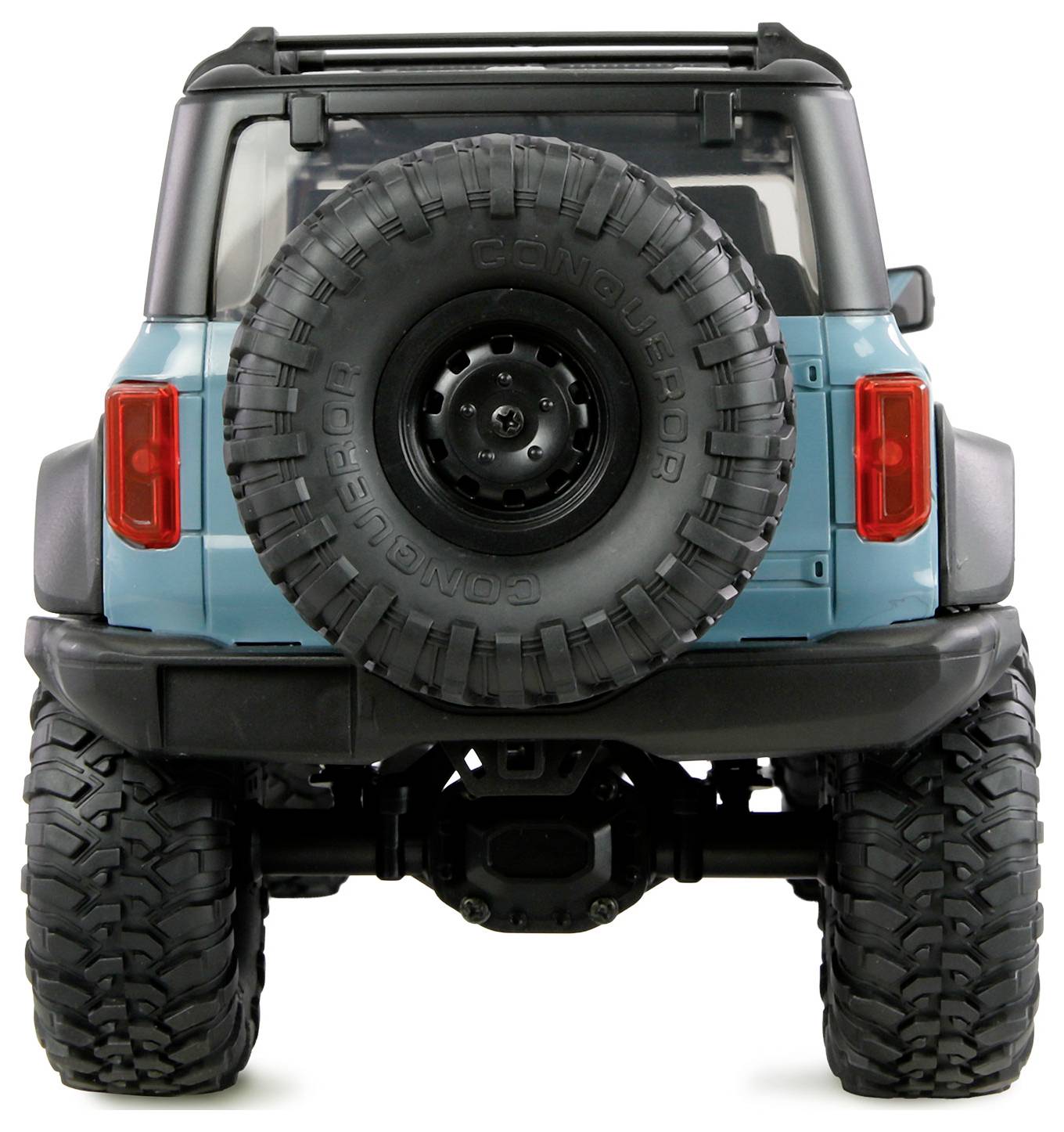 Ein blaues Offroad-Fahrzeug von hinten betrachtet, mit einem Ersatzreifen, der an der Rückseite montiert ist.