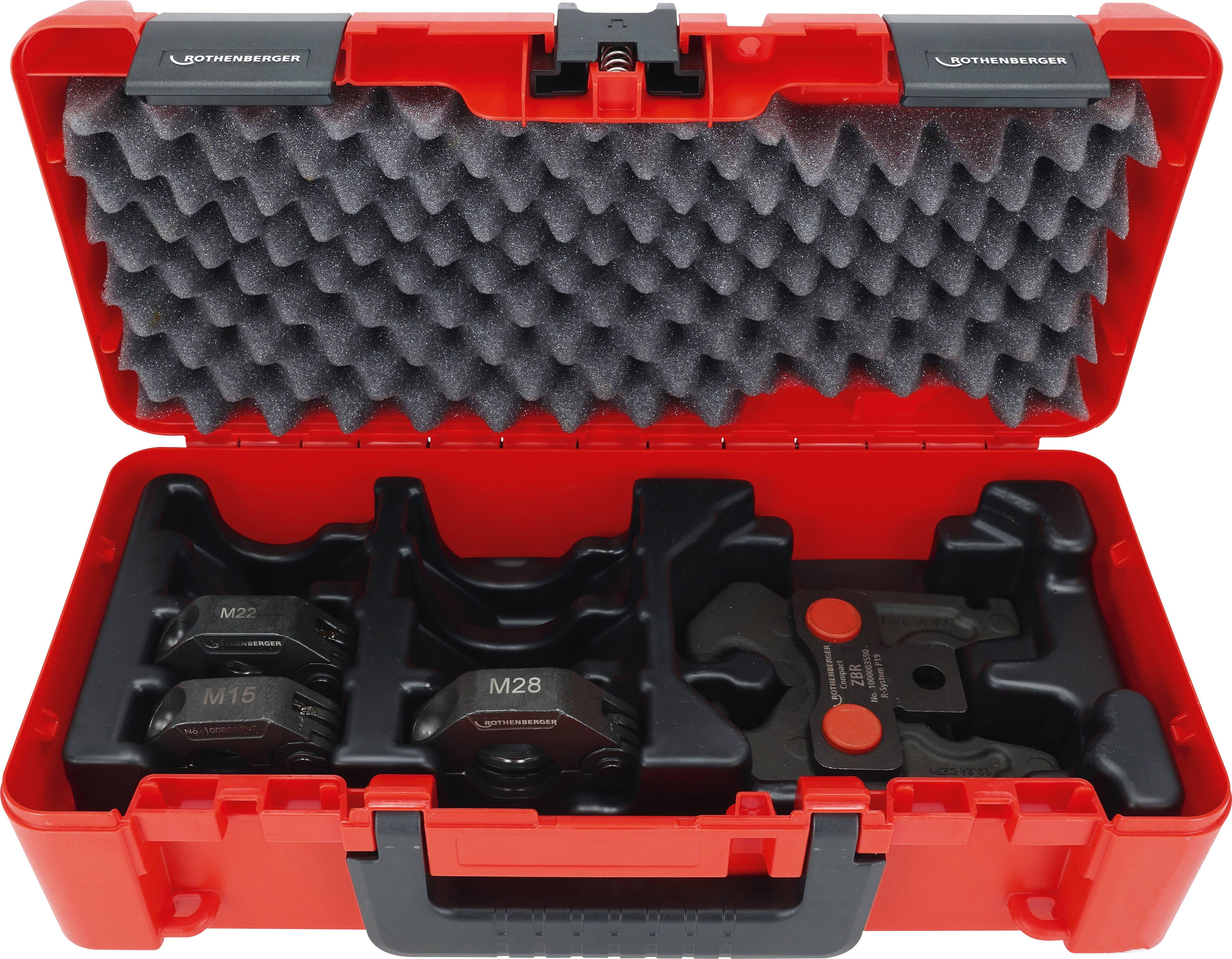 Roter Kunststoffwerkzeugkasten mit verschiedenen Markenmechanikteilen auf Schaumstoffpolsterung angeordnet, konzipiert für Pressvorgänge.