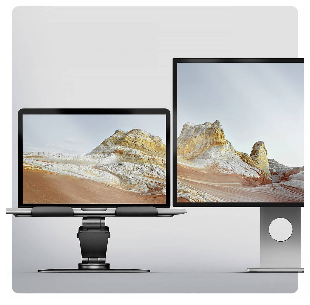 Ein Setup mit zwei Monitoren, das ein Landschaftsbild mit felsigen Hügeln zeigt. Die Bildschirme stehen auf schlanken Ständern, was auf einen modernen Arbeitsplatz hindeutet.