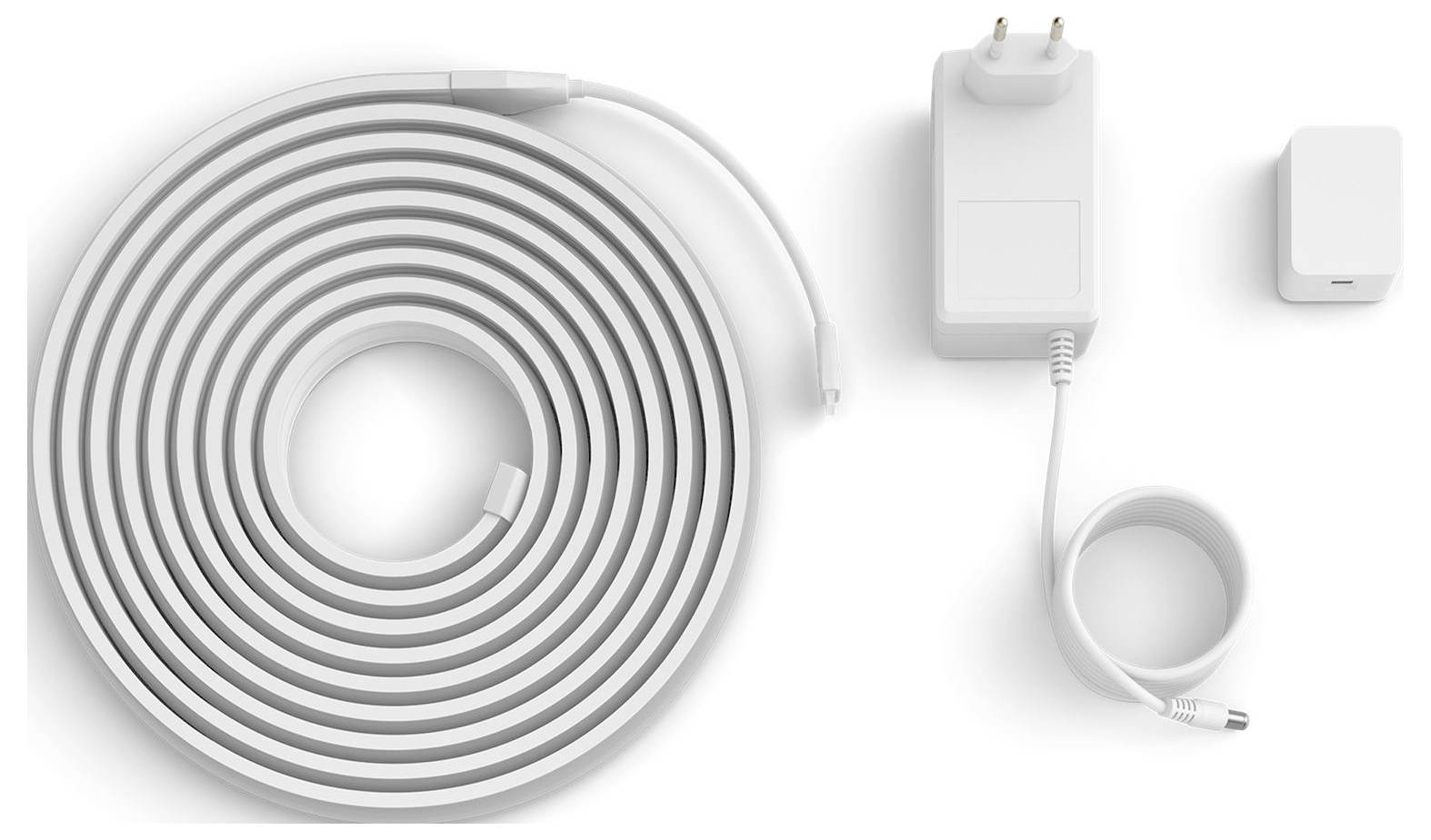 Aufgerollter intelligenter LED-Lichtstreifen mit Netzteil, Verbindungsstücken und Steuereinheit, entwickelt für flexible und anpassbare Beleuchtung.