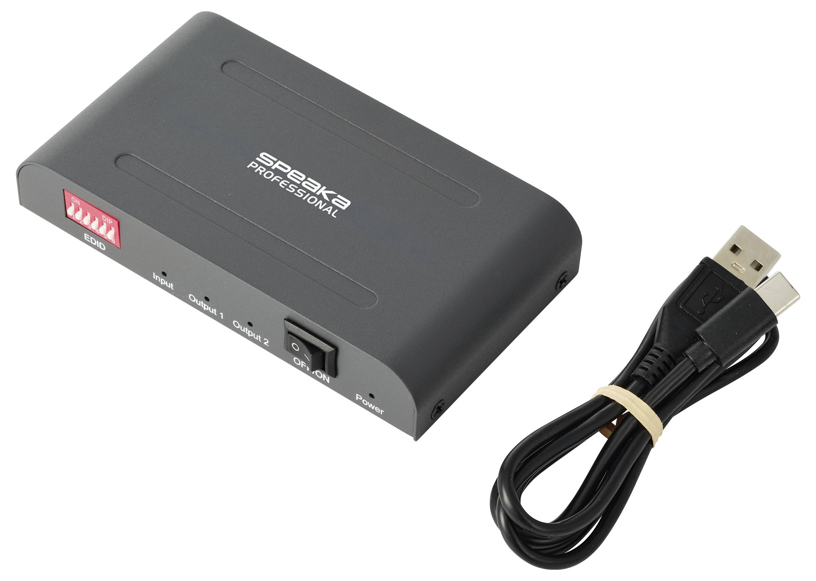 USB-Audio-Adapterkästchen mit schwarzem USB-Kabel daneben, beschriftet mit „Speaka Professional