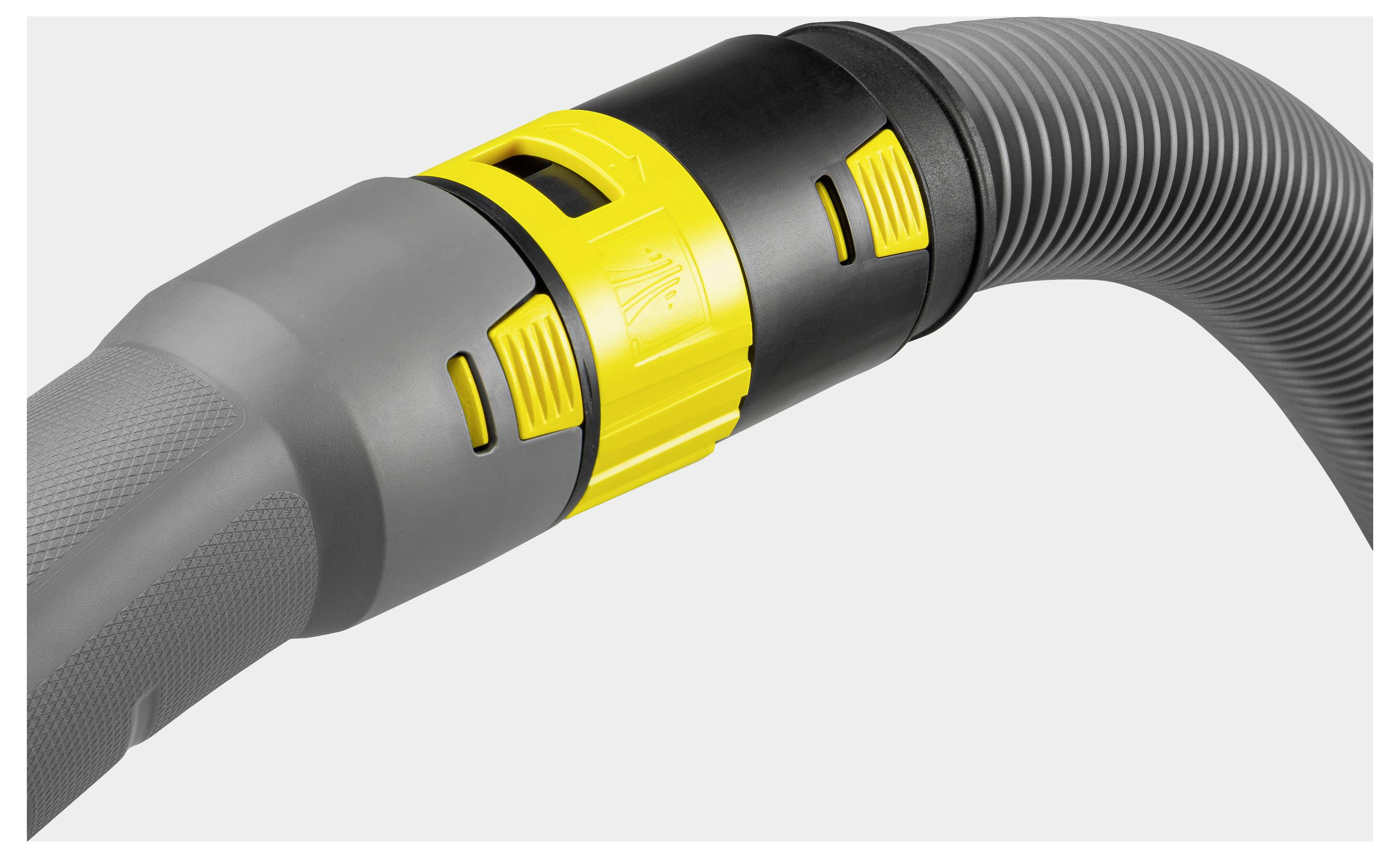 Eine Nahaufnahme eines Staubsaugerschlauchs zeigt eine gelb-schwarze verstellbare Düse mit einem strukturierten grauen Griff, die seinen Grip und seine Funktionalität veranschaulicht.