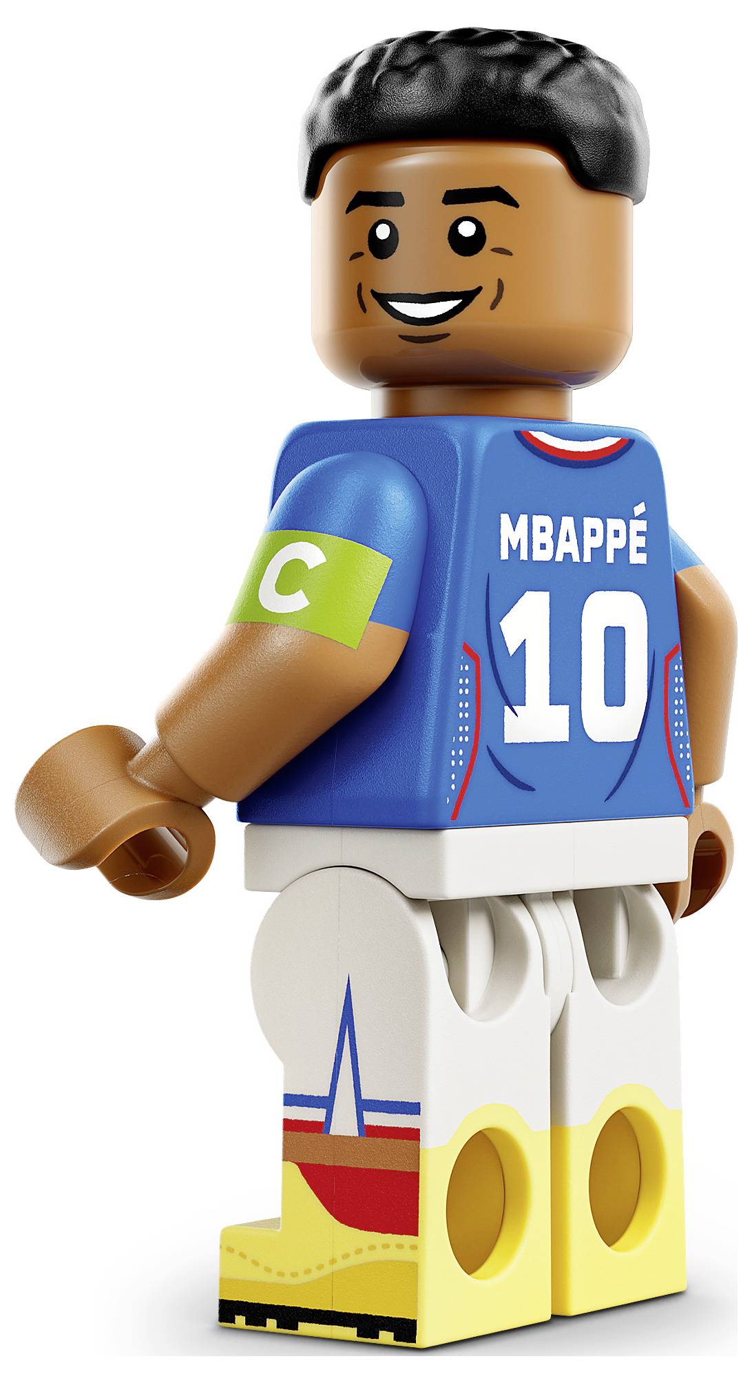 LEGO-artige Minifigur des Fußballspielers Mbappé in einem blauen Frankreich-Trikot mit der Nummer 10 und Kapitänsbinde, stehend auf weißem Hintergrund.